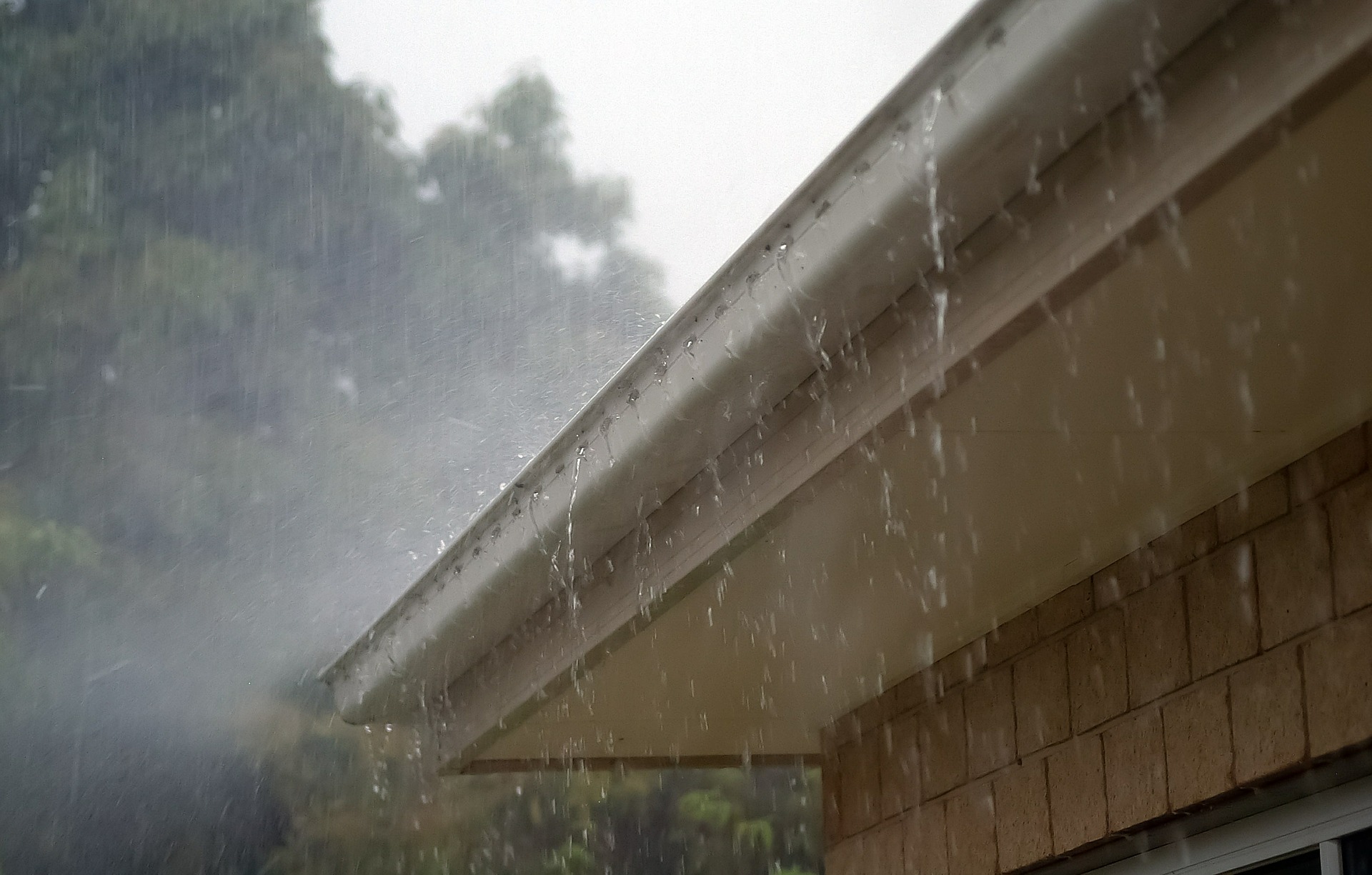 Rain falling off gutters